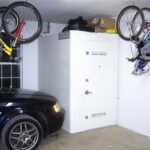 White storm shelter in the corner of a garage