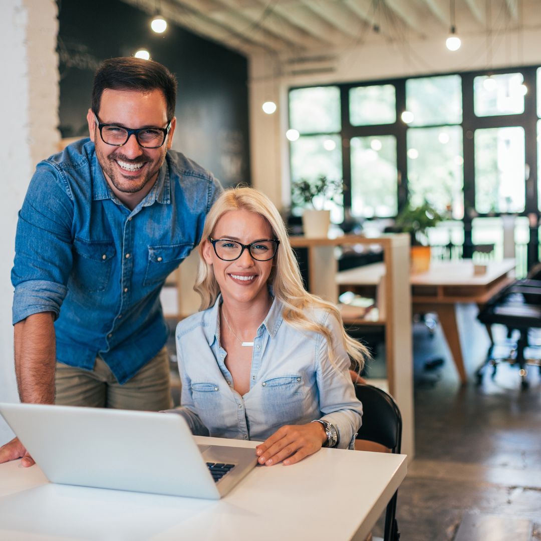 two business owners smiling