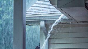 a storm with water running off the roof