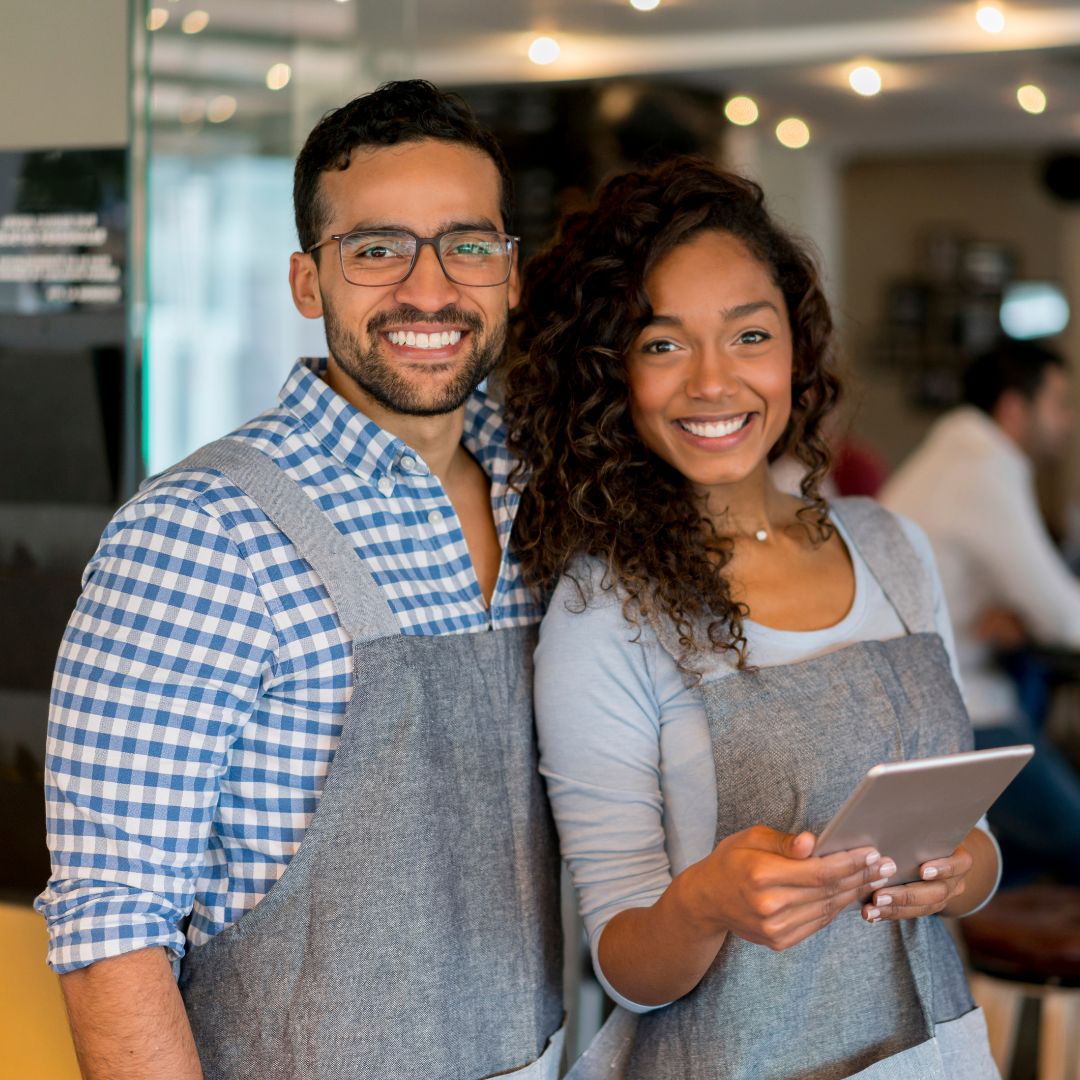 Two employees smiling