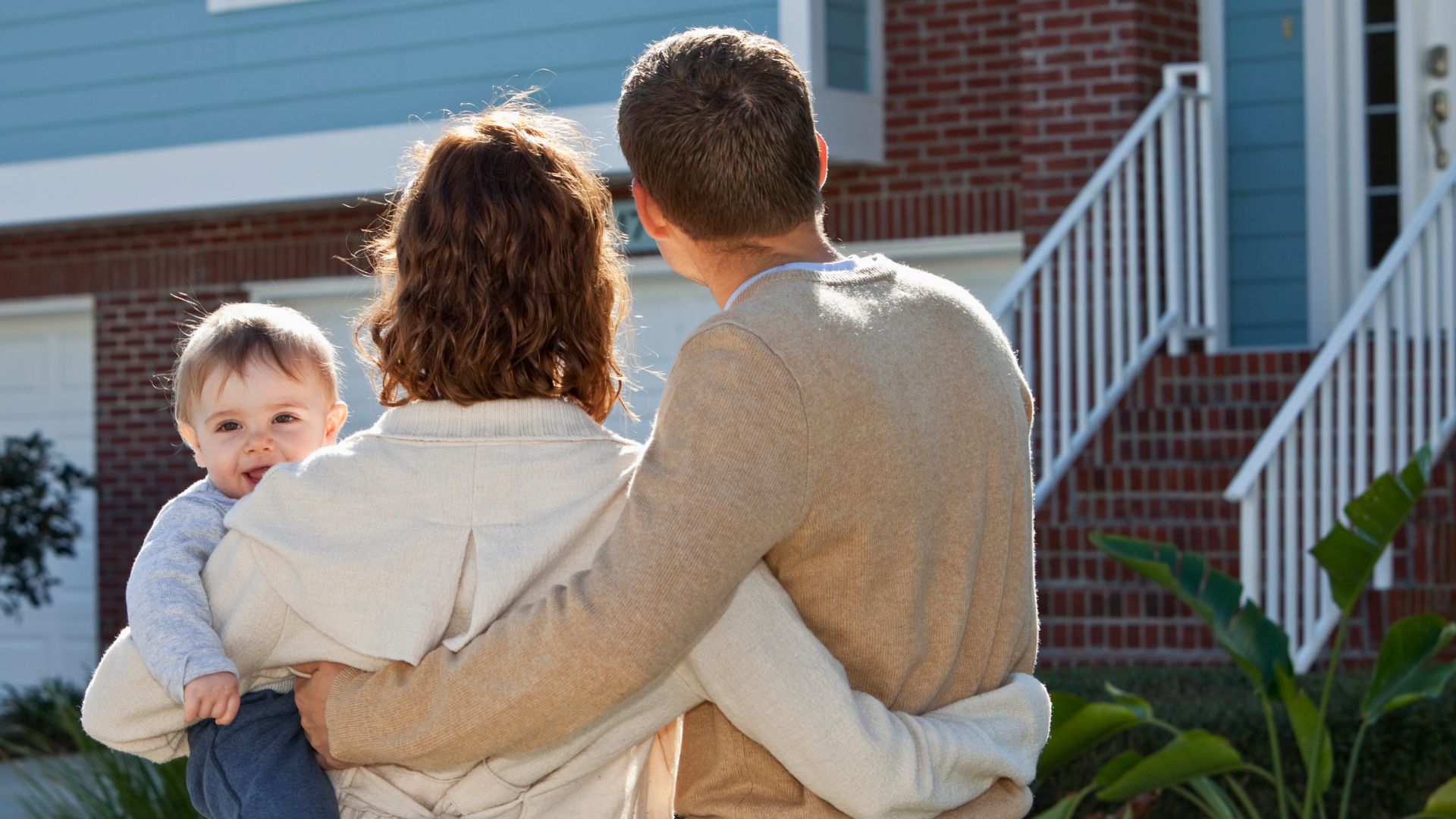 family looking at house