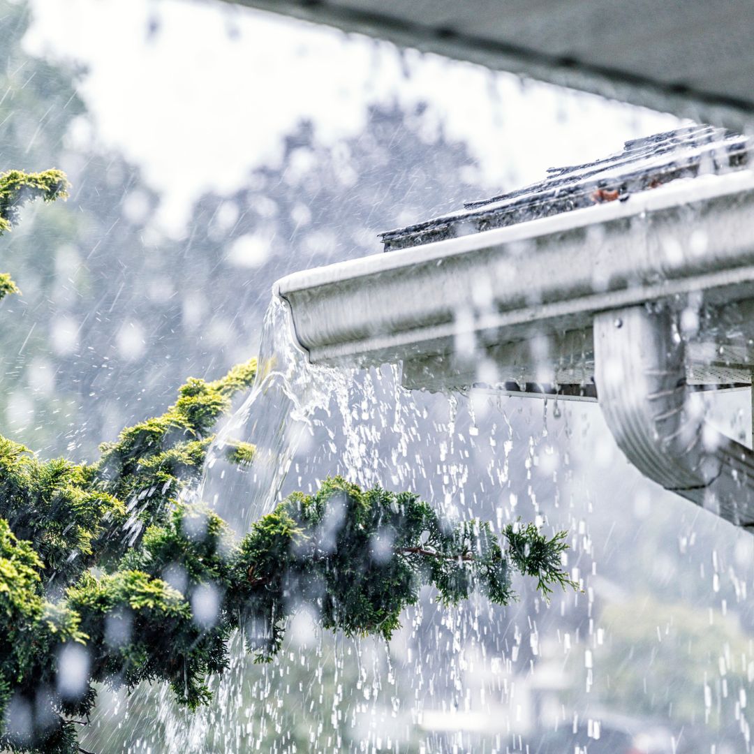 rain falling off house