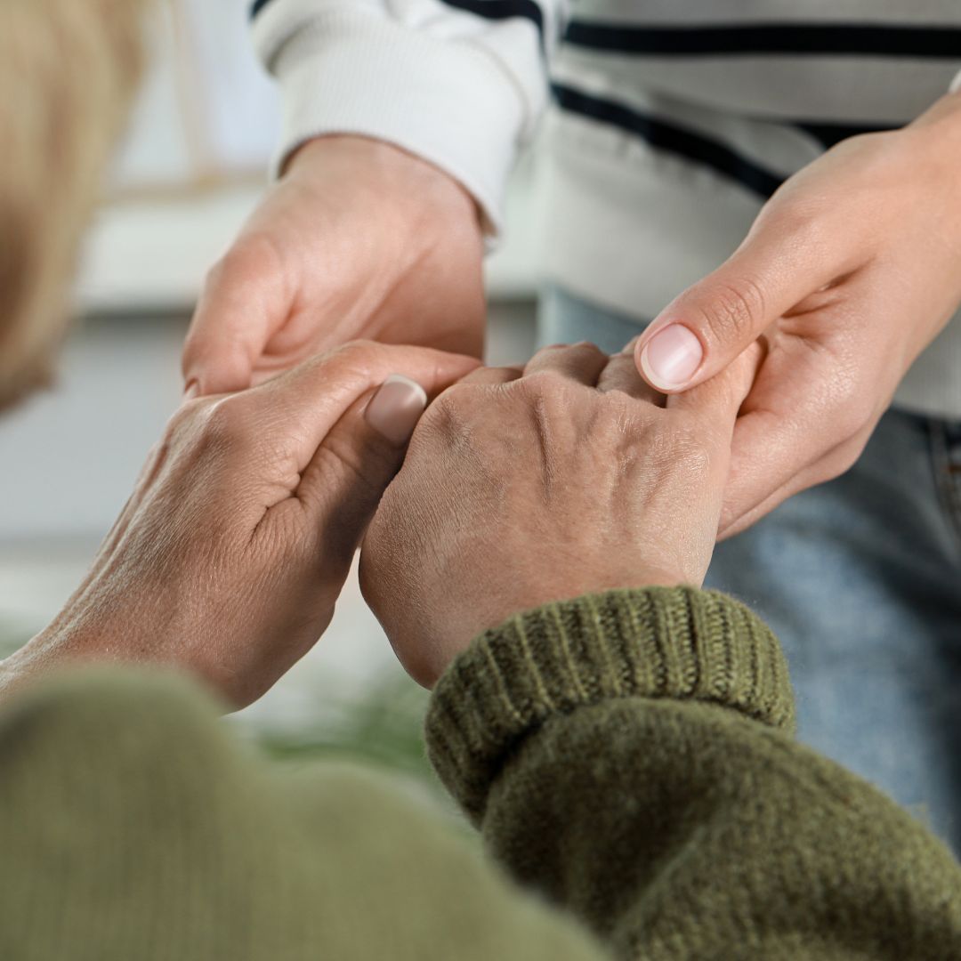 Family members holding hands