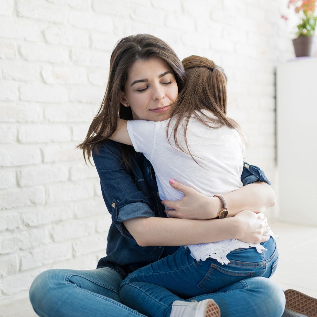 A mother hugging her child