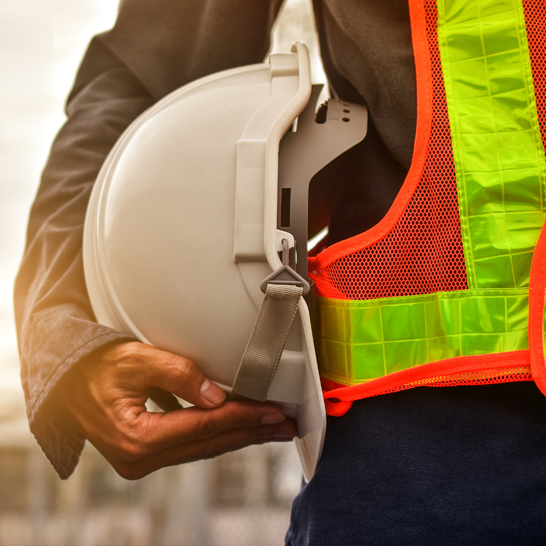 Man holding a hard hat. 