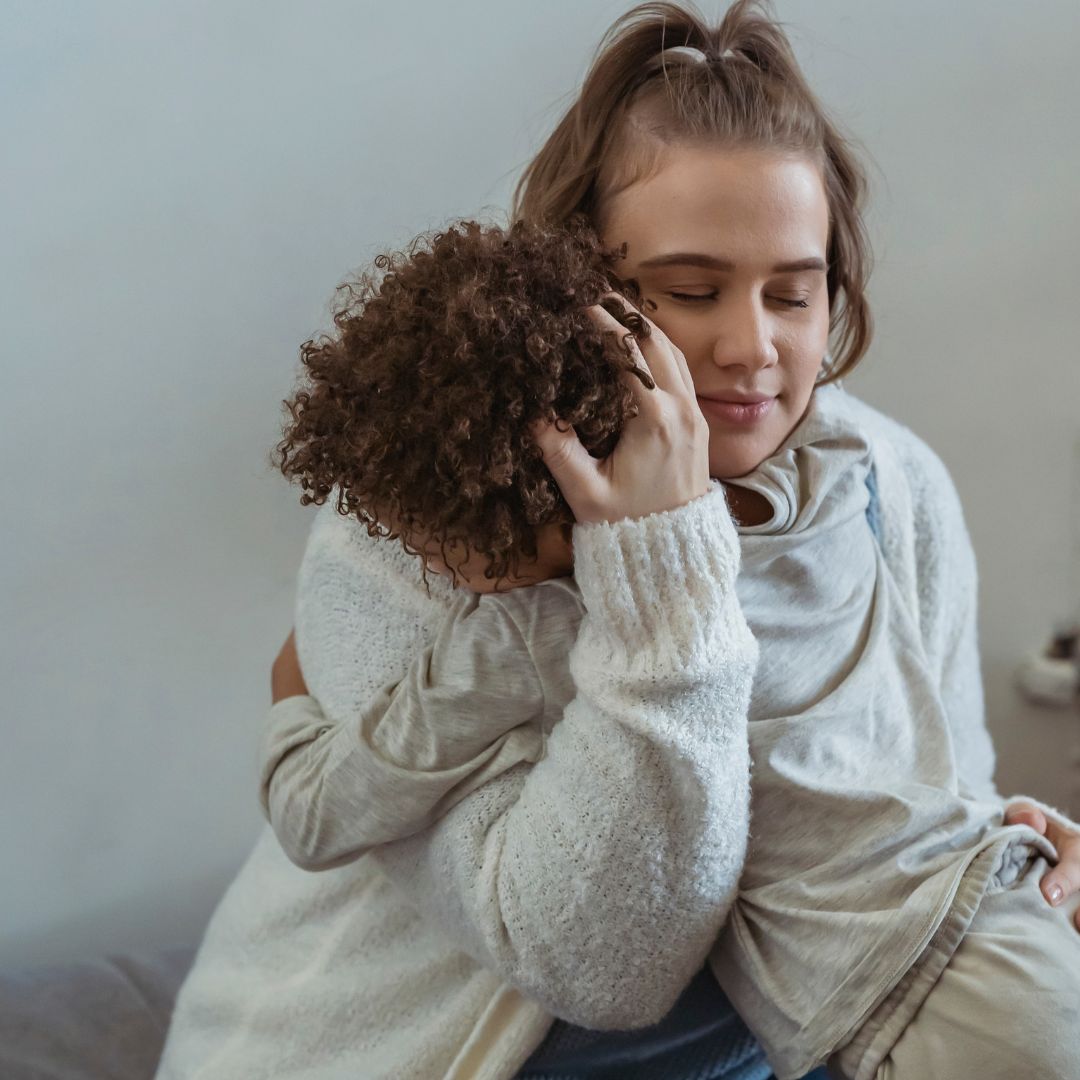 mom holding child