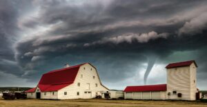 Farm house in front of a tornado