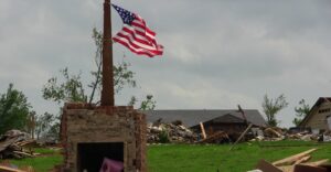 American flag standing and flying after a tornado