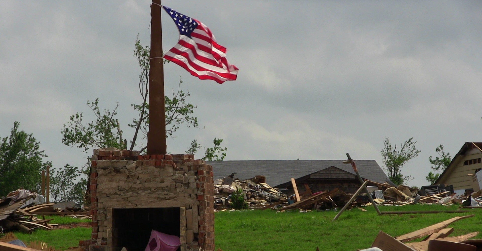 American flag standing and flying after a tornado