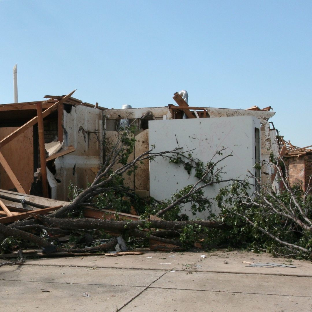 FamilySAFE shelter standing among house rubble