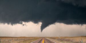 tornado hovering over highway