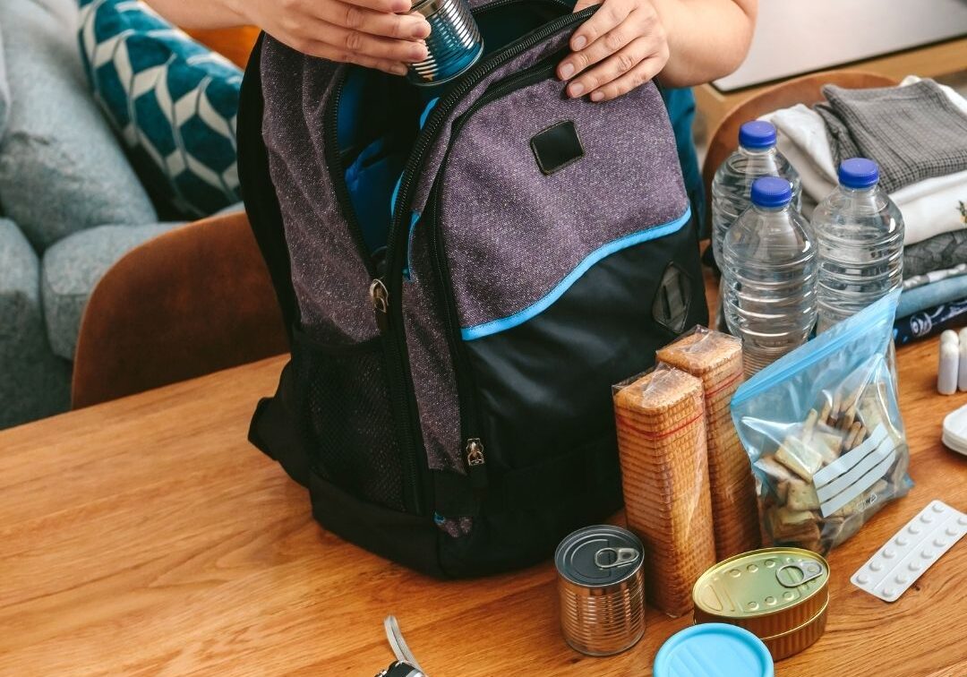 packing food and water into a backpack