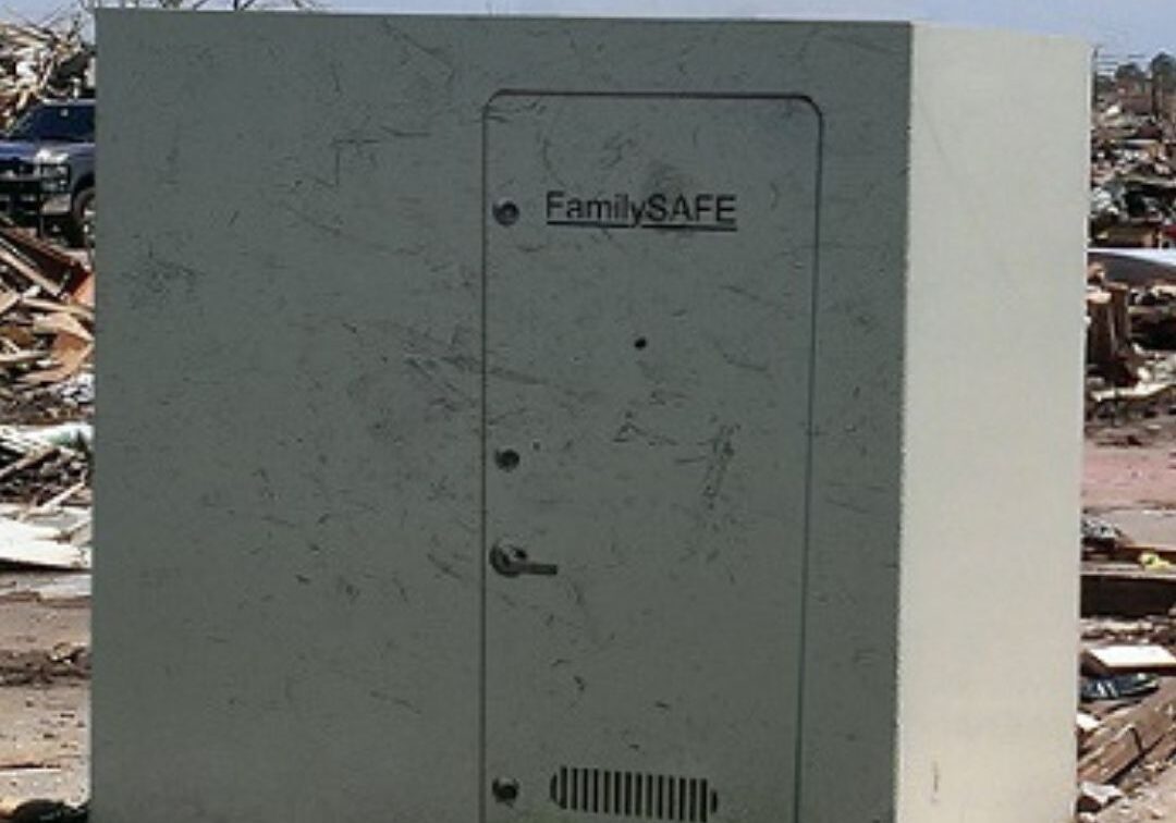 a steel storm shelter standing after a storm