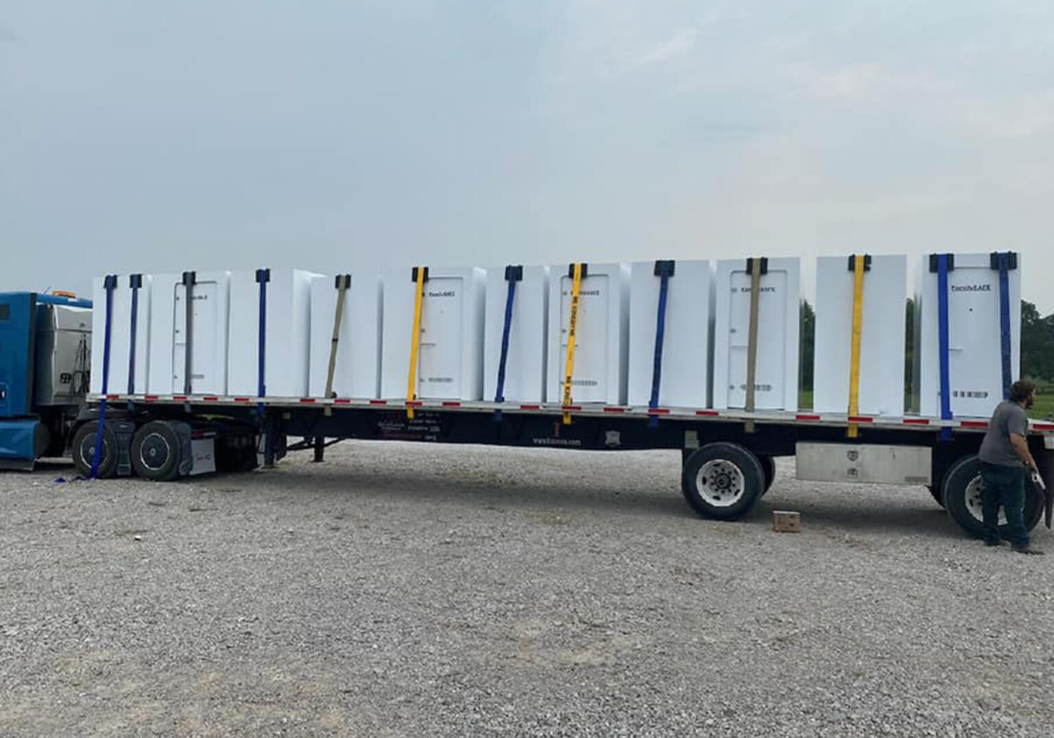 truck loaded with family safe storm shelters